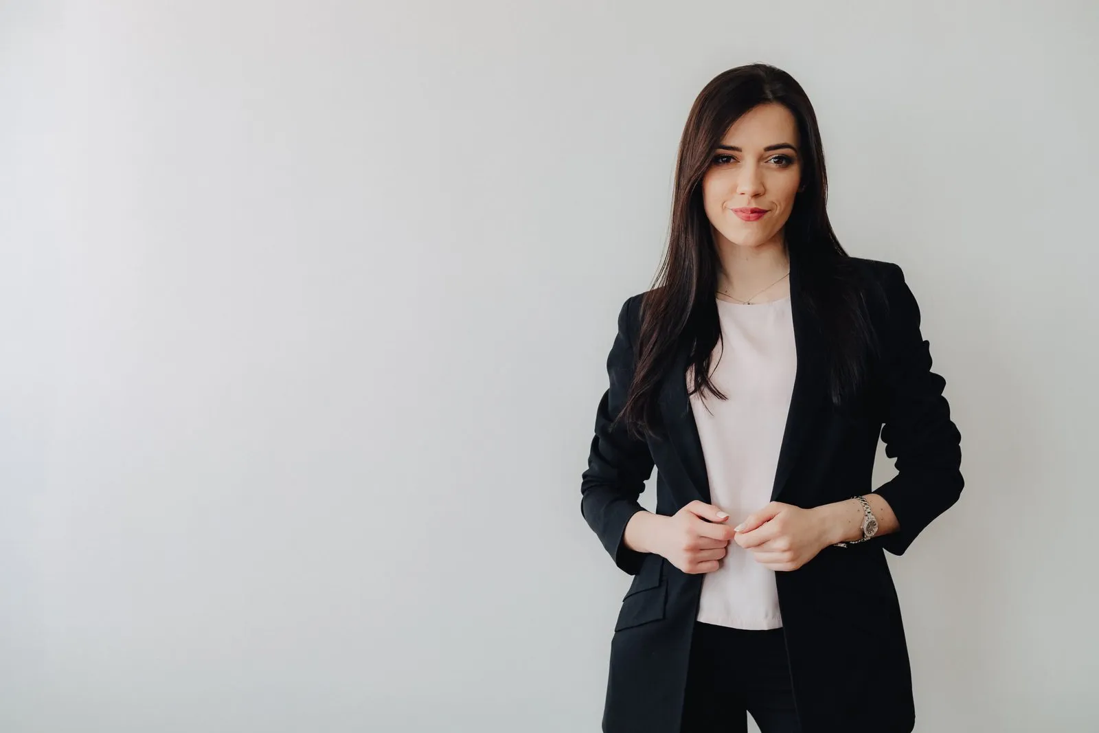 Smiling businesswoman in a black blazer